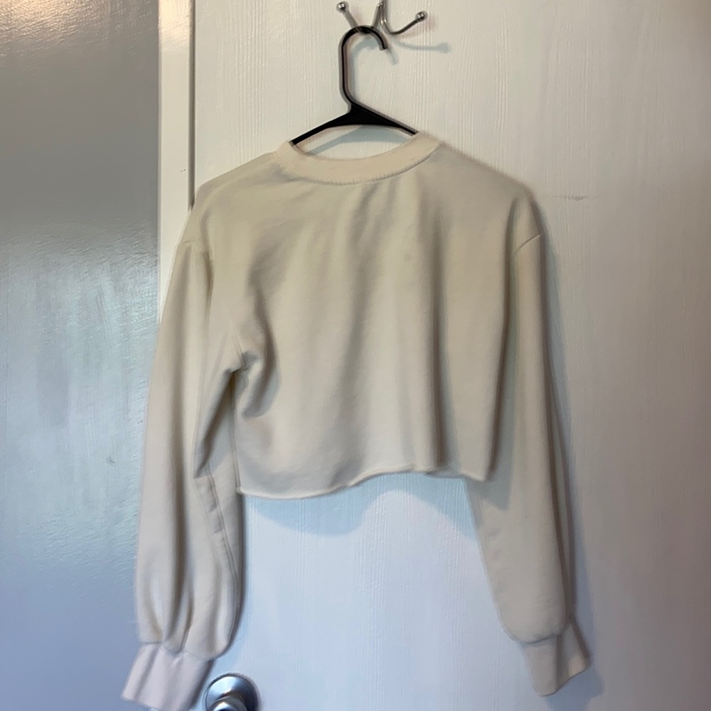 Women’s brown and white sweaters